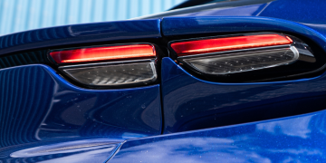 Artificial Intelligence in Supercars: Ways It’s Impacting Luxury Cars Logo