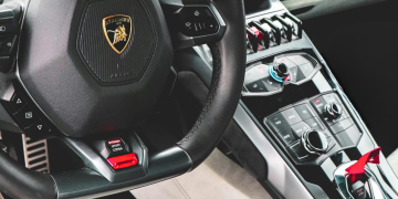 From Carbon Fibre to Alcantara: The Art of the Supercar Interior Logo